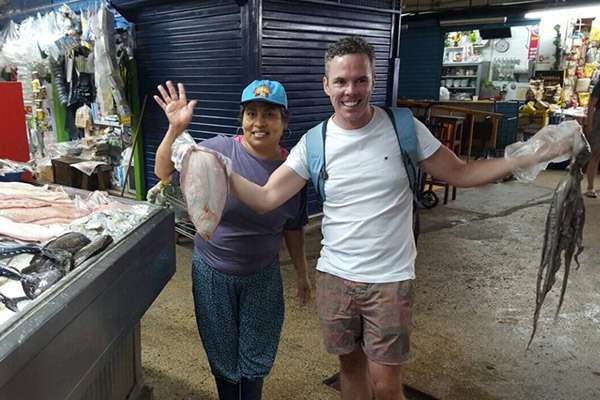 Visitor having fun at the Surquillo Fish market