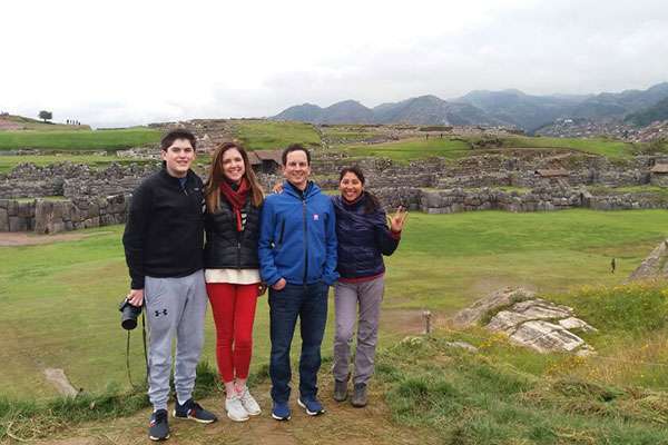 Family and guide at Sacsayhuaman