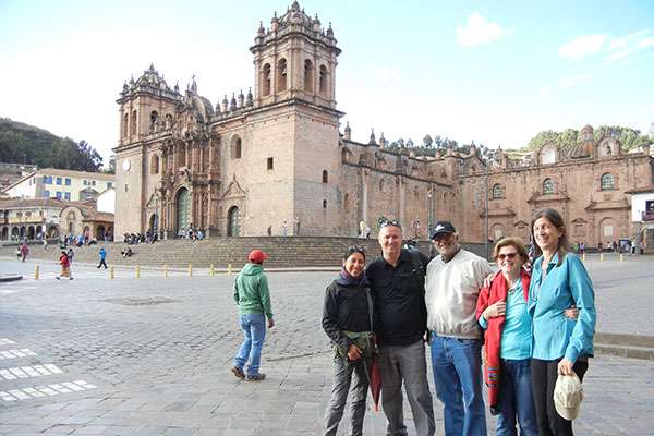 Friends and guide in front of Cusco's Cathedral