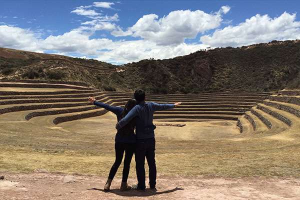Couple with open arms at Moray Terraces