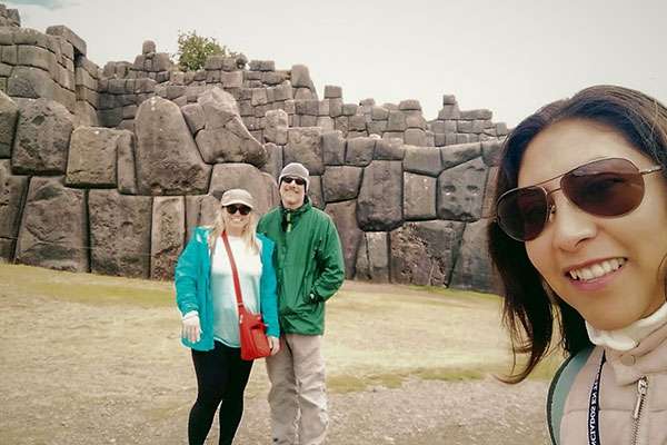 Visitors with guide in Sacayhuaman