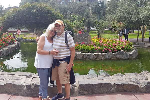 Couple enjoying walk at Olive park in San Isidro