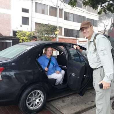 Couple being picked up by black vehicle